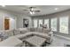 Bright living room with a comfy sectional sofa, tv and lots of natural light at 1777 Water Springs Way, Dacula, GA 30019