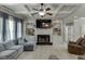 Bright living room with coffered ceiling, fireplace, built-in shelving, and inviting decor at 1777 Water Springs Way, Dacula, GA 30019