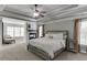 Spacious main bedroom with tray ceiling, fireplace, and sitting area at 1777 Water Springs Way, Dacula, GA 30019