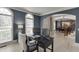 Comfortable office space with two windows and an arched doorway at 1777 Water Springs Way, Dacula, GA 30019