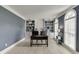 Bright office space with built-in shelving, light wood floors, and large windows at 1777 Water Springs Way, Dacula, GA 30019