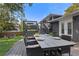 Outdoor dining setup on a spacious wooden deck with stairs, perfect for entertaining guests at 2416 Elmwood Se Cir, Atlanta, GA 30339