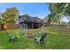 Spacious backyard featuring a fire pit, deck, and plenty of room for outdoor activities at 2416 Elmwood Se Cir, Atlanta, GA 30339