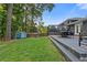 Expansive backyard with a shed, deck, and lush lawn, ideal for outdoor activities and relaxation at 2416 Elmwood Se Cir, Atlanta, GA 30339