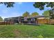 Spacious backyard featuring a deck, patio, and ample green space for outdoor enjoyment at 2416 Elmwood Se Cir, Atlanta, GA 30339