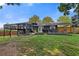 Lush backyard with a deck, patio, and plenty of room for outdoor recreation and relaxation at 2416 Elmwood Se Cir, Atlanta, GA 30339