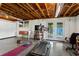 Partially finished basement area ideal for workout room with exercise equipment, tv, and walkout at 2416 Elmwood Se Cir, Atlanta, GA 30339