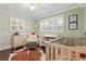 Charming bedroom with neutral paint, vintage accessories, and abundant natural light at 2416 Elmwood Se Cir, Atlanta, GA 30339