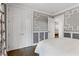 Bedroom with elegant trim work, access to deck, and stylish patterned curtains at 2416 Elmwood Se Cir, Atlanta, GA 30339