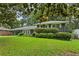 Charming home with a well-maintained front yard and a welcoming entrance with covered parking at 2416 Elmwood Se Cir, Atlanta, GA 30339
