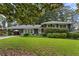 Charming home with a well-maintained front yard and a welcoming entrance with covered parking at 2416 Elmwood Se Cir, Atlanta, GA 30339