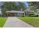 The home has an inviting exterior with well-manicured lawn and a covered parking area at 2416 Elmwood Se Cir, Atlanta, GA 30339