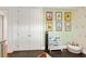 Hallway showing closet with organized bookshelves, and a playroom at 2416 Elmwood Se Cir, Atlanta, GA 30339