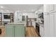 Modern kitchen with white cabinets, stainless steel appliances, and breakfast bar at 2416 Elmwood Se Cir, Atlanta, GA 30339