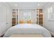 Bedroom with built-in bookshelves and drawers surrounding window at 2416 Elmwood Se Cir, Atlanta, GA 30339