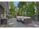 Upper deck with outdoor seating and storage, great for enjoying the surrounding trees at 2416 Elmwood Se Cir, Atlanta, GA 30339