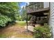 Exterior shot showcasing a deck and stairs leading to the yard, blending indoor and outdoor living at 3710 Ridgefair Dr, Cumming, GA 30040