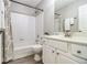 Bathroom featuring a shower/tub combo with tile surround and a vanity sink at 3710 Ridgefair Dr, Cumming, GA 30040