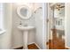 Bathroom with a pedestal sink and a view into the adjacent living space at 3710 Ridgefair Dr, Cumming, GA 30040