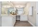 Bright bathroom with dual sinks, white cabinetry, and modern fixtures at 3710 Ridgefair Dr, Cumming, GA 30040