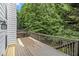 Spacious deck featuring wood railings, offering an ideal spot for outdoor relaxation and entertaining at 3710 Ridgefair Dr, Cumming, GA 30040