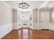 Bright dining room featuring a bay window, hardwood floors, and modern lighting at 3710 Ridgefair Dr, Cumming, GA 30040