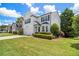 Two-story home with black shutters and lush landscaping on a sunny day at 3710 Ridgefair Dr, Cumming, GA 30040