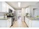 Bright kitchen features granite counters, stainless steel appliances, and white cabinetry at 3710 Ridgefair Dr, Cumming, GA 30040