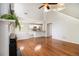 Open-concept living room with a kitchen featuring white cabinetry and granite counters at 3710 Ridgefair Dr, Cumming, GA 30040