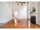 Spacious living room with hardwood floors, fireplace, and natural light at 3710 Ridgefair Dr, Cumming, GA 30040