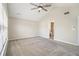 Spacious main bedroom featuring vaulted ceilings, ceiling fan, and large window at 3710 Ridgefair Dr, Cumming, GA 30040