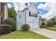 Two-story home showing siding, a manicured lawn and tidy landscaping at 3710 Ridgefair Dr, Cumming, GA 30040