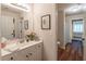 This bathroom features a white vanity, sink and shower with blue patterned curtain at 510 Independence Way, Roswell, GA 30075