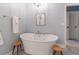Modern bathroom featuring an oval soaking tub and chrome fixtures at 510 Independence Way, Roswell, GA 30075