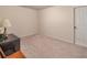 Cozy bedroom with neutral carpet and a dark accent cabinet at 510 Independence Way, Roswell, GA 30075