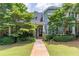 Charming townhome with mature landscaping, a walkway to the front door and serene curb appeal at 510 Independence Way, Roswell, GA 30075