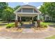 Beautiful outdoor gazebo with seating, landscaping, and stone features at 510 Independence Way, Roswell, GA 30075