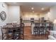 Open kitchen with island seating, stainless steel appliances, and ample counter space for entertaining at 510 Independence Way, Roswell, GA 30075
