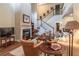 Spacious living room with fireplace, staircase, and plenty of natural light at 510 Independence Way, Roswell, GA 30075