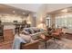 Bright and airy living room with vaulted ceilings, open to kitchen, and stylish furniture at 510 Independence Way, Roswell, GA 30075