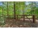 View of backyard with wooden fence, enhancing privacy and security at 5605 Miners Rdg, Cumming, GA 30028
