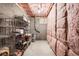 This unfinished basement is insulated and offers storage with metal shelving units at 5605 Miners Rdg, Cumming, GA 30028