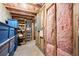 This unfinished basement is insulated and offers storage space with plastic containers at 5605 Miners Rdg, Cumming, GA 30028