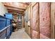 Unfinished basement with insulation and storage totes, providing ample storage space at 5605 Miners Rdg, Cumming, GA 30028