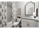 Bright bathroom featuring a vanity with granite countertops and a shower with patterned curtain at 5605 Miners Rdg, Cumming, GA 30028