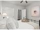 Bright bedroom with soft decor, a black metal bed, and a soothing, comfortable atmosphere at 5605 Miners Rdg, Cumming, GA 30028