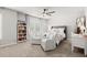 Bright bedroom features a cozy seating area, stylish decor, and plenty of natural light at 5605 Miners Rdg, Cumming, GA 30028
