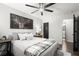 Relax in this bedroom with modern ceiling fan, with a view to the ensuite bathroom at 5605 Miners Rdg, Cumming, GA 30028