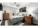 A comfortable bedroom featuring a ceiling fan and a coordinated color palette at 5605 Miners Rdg, Cumming, GA 30028