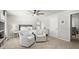 Bedroom features a seating area, plush carpet, and a calming atmosphere for relaxation at 5605 Miners Rdg, Cumming, GA 30028